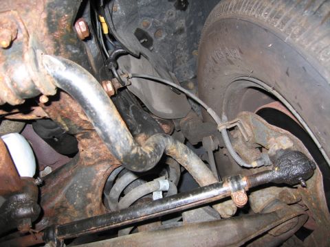 1991 Ford LTD Crown Victoria - Undercarriage view of suspension parts, showing rust and wear.