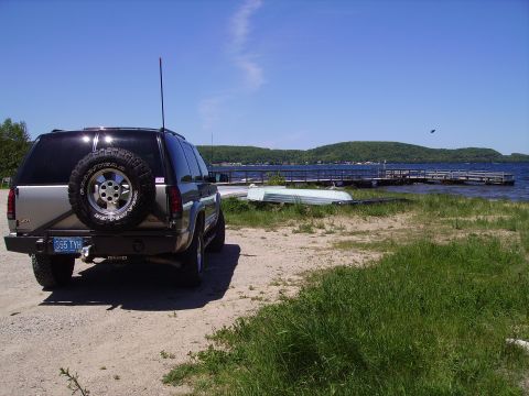 2000 Chevrolet Tahoe - Rear view of a 2000 Chevrolet Tahoe parked near a lake with a dock and boats.