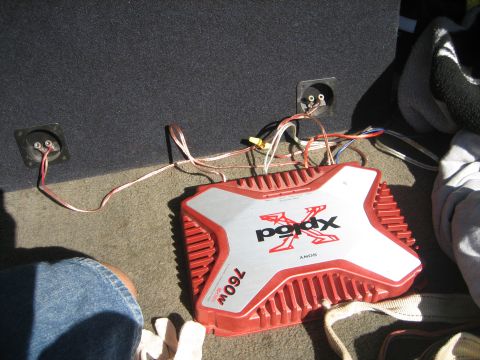 1989 Ford Bronco - A Sony Xplod amplifier is shown connected to a speaker box, likely in the trunk of a vehicle.