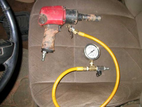 1990 Ford Bronco - A couple of things that never leave the truck. A Harbor Freight impact wrench and my home made tire filling rig.