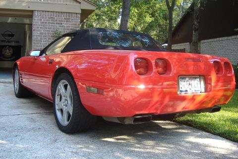 1994 Chevrolet Corvette - This red convertible sports car has a distinctive rear design with quad taillights.