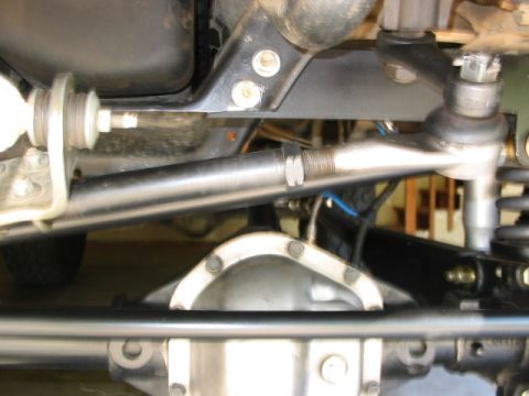 1995 Ford Bronco - Undercarriage view shows steering components and rear differential housing.