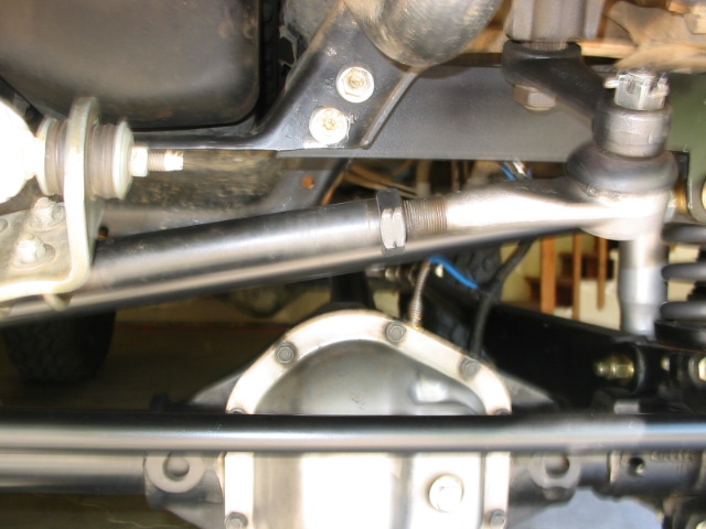 Underside of Ford Bronco showing steering linkage, suspension, and aluminum diff cover