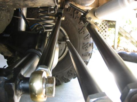 1995 Ford Bronco - stock axle trackbar mount with a welded on spacer made from 1 square block of 1/2" plate drilled for 3/4" hole, and a 3/4" length, piece of…