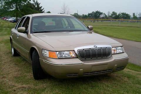 1999 Mercury Marquis - This 1999 Mercury Grand Marquis is shown from a three-quarter front angle, highlighting its distinctive grille.