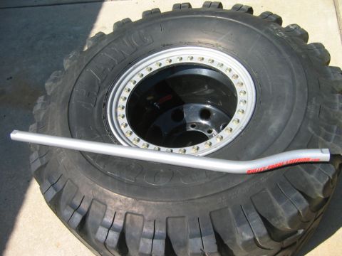 1985 Ford Bronco - Oversized tire and steering bar. The text on the bar indicates it is from Bullet Proof Steering.