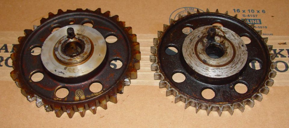 Two used timing gears with visible wear on teeth