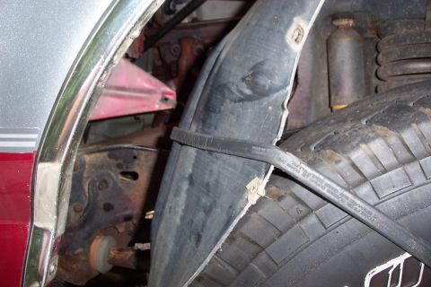 1995 Ford Bronco - Inner fender peel back with a bungi cord, made life easier removing flange nuts!