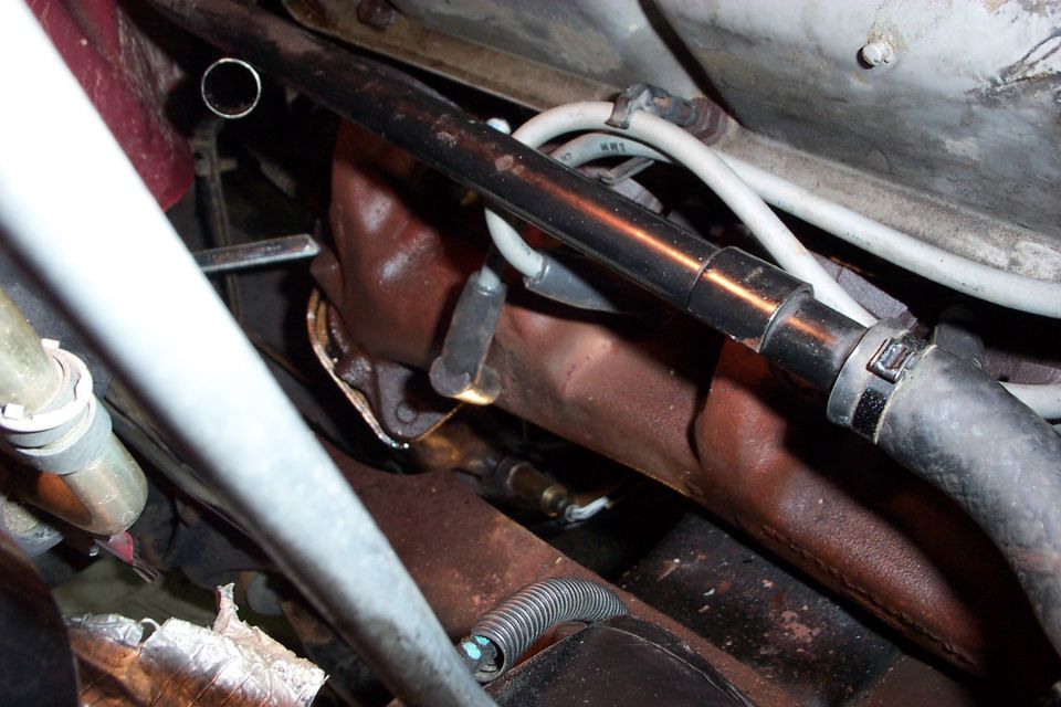 Wrench on flange nut, thru the inner fender and over frame rail.
