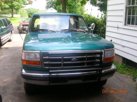 1996 Ford Bronco - This 1996 Ford Bronco is seen from the front, a brush guard and a teal green paint job.