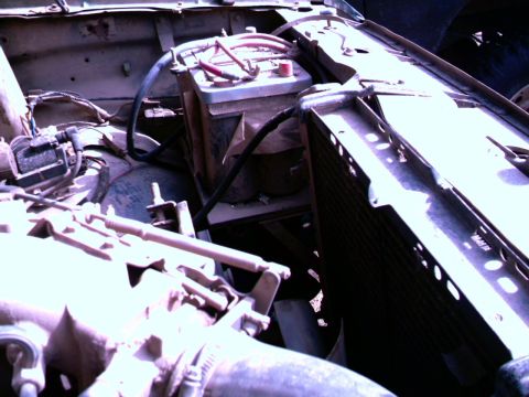 1987 Ford Bronco II - Close-up of an engine bay with dual batteries and radiator visible.
