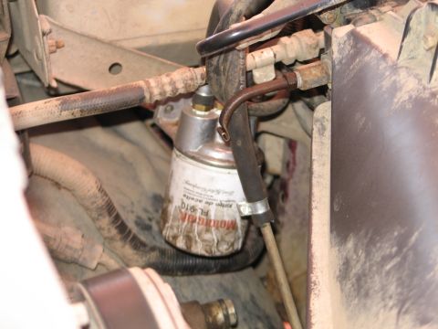 1995 Ford Bronco - Close-up view of a transmission cooler line and oil filter assembly.