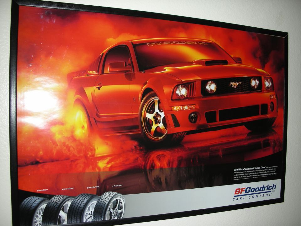 Framed BFGoodrich poster of a red Mustang surrounded by fire
