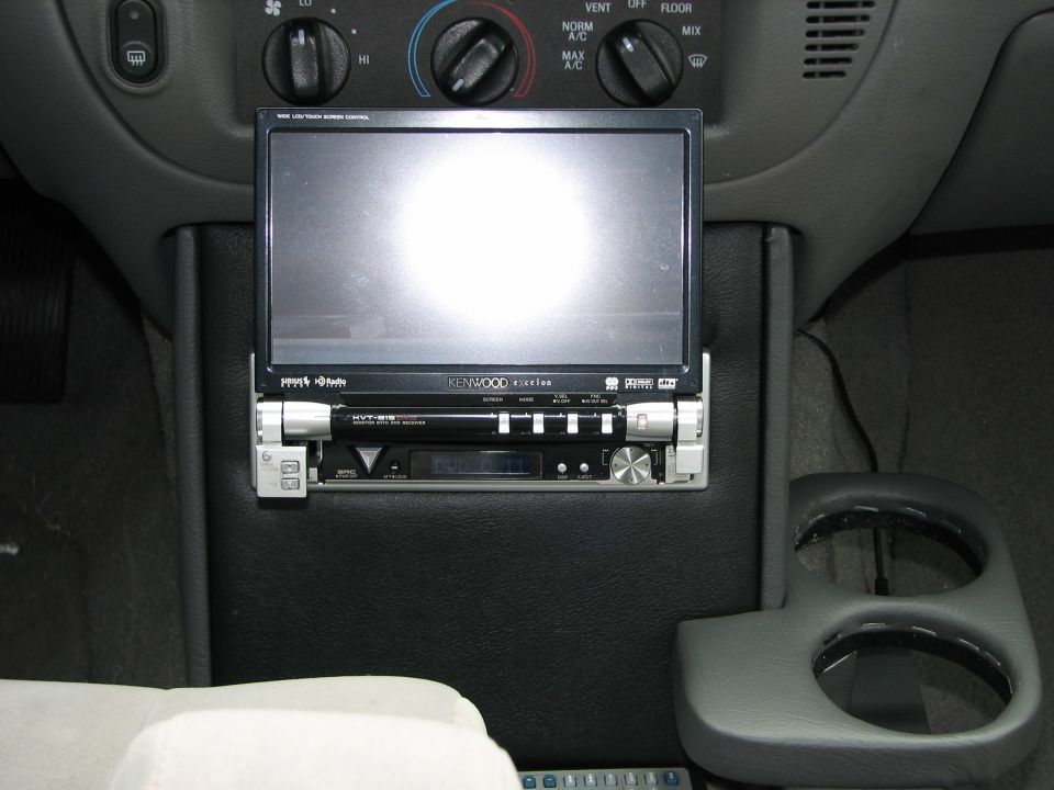 Center console with aftermarket Kenwood stereo and screen