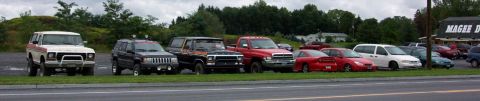1978 Ford Bronco - A white and red 1978 Ford Bronco is parked in a lot with other vehicles.
