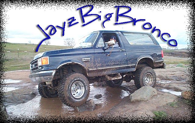 Lifted dark blue Ford Bronco on rocks with JayzBigBronco text overlay