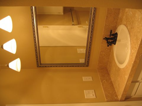 1994 Ford Probe - Bathroom scene with sink, mirror, and pendant lights. Supermotors.net logo is present.