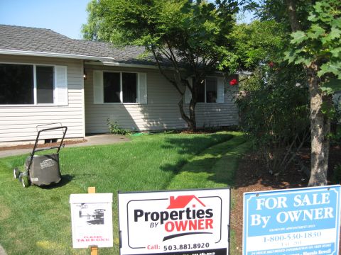 1994 Ford Probe - Lawnmower and real estate signs are visible in front of a suburban house.