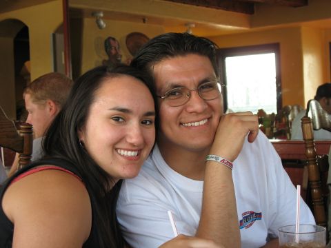 1997 Ford Probe - A couple smiles for a photo while seated at a table in what appears to be a restaurant.