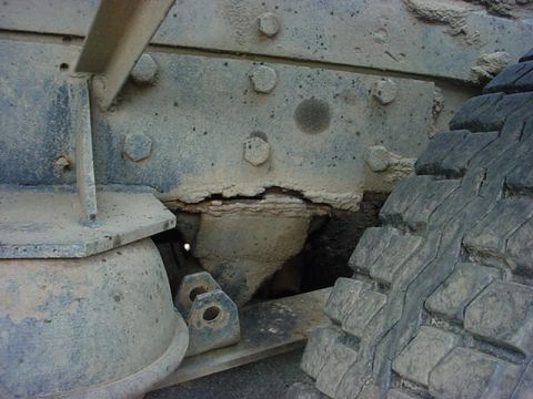 1979 Ford Bronco - Detail of a heavily corroded truck suspension system, showing wear and tear.