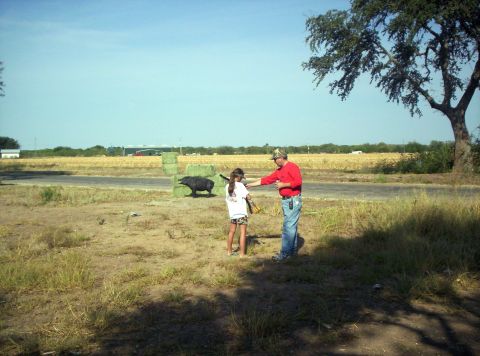 1986 Ford Bronco - Alexis receiving instruction from Bobby Nelson head of the Outback Oasis Archery staff.