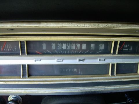 1971 Ford F-100 - Close-up of a vehicle's dashboard, the speedometer, fuel gauge, and temperature gauge.