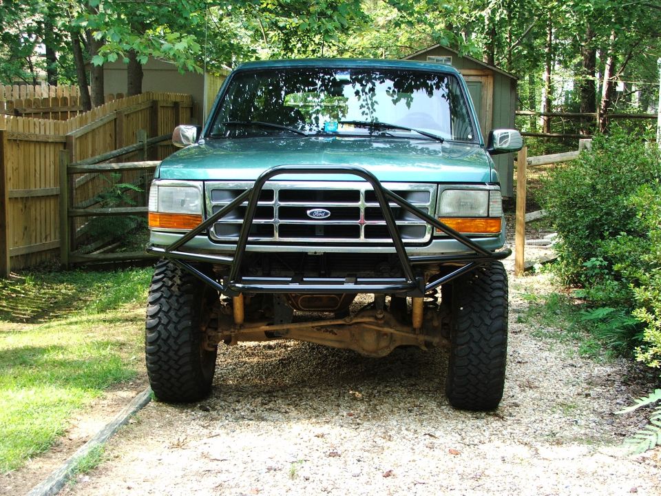 Green 1996 Ford Bronco front view with bull bar