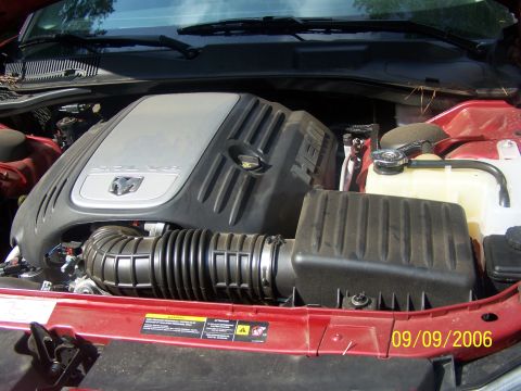 1979 Ford F-150 - Close-up of a Dodge Hemi V8 engine bay, showing the engine cover and air intake system.