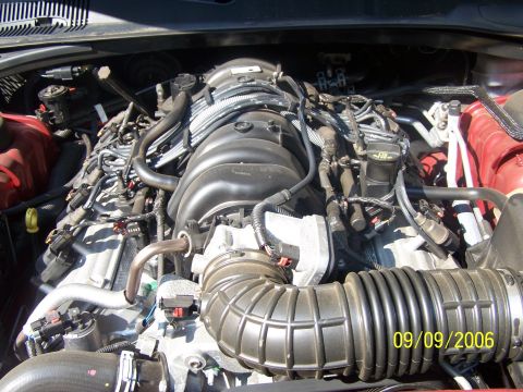 1979 Ford F-150 - Close-up view of a vehicle's engine bay, showing various components and hoses. The photo is dated 09/09/2006.