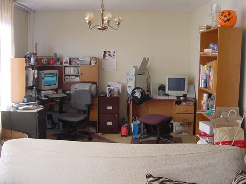 1979 Ford Bronco - This home office appears to be a workspace filled with computers, printers, and various office supplies.