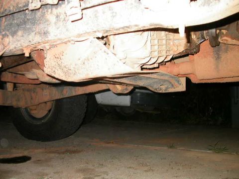 1990 Ford Bronco - This t-case skid plate has obviously been way overworked.