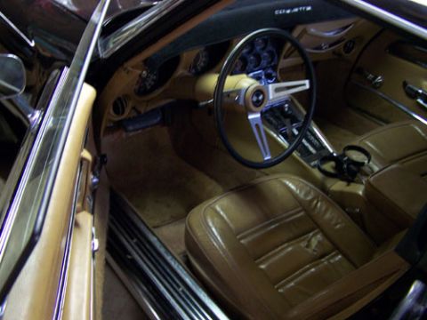 1975 Chevrolet Corvette - The interior of a 1975 Chevrolet Corvette features tan leather seats and a classic dashboard layout.