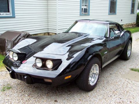 1975 Chevrolet Corvette - 1975 Chevrolet Corvette with pop-up headlights and chrome wheels.