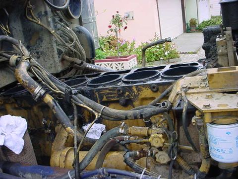 1979 Ford Bronco - Close-up view of a disassembled diesel engine block, showing the cylinders and various engine components.