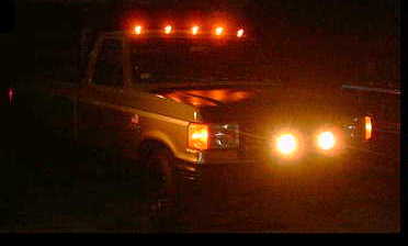 1979 Ford Bronco - This 1979 Ford Bronco is captured at night, its roof lights and front fog lights brightly lit.