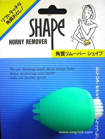 1999 Ford Crown Victoria - Product packaging for a 'Shape Horny Remover' with text in English and Japanese, and a graphic of a woman.