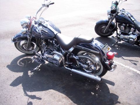 1972 Ford Ranchero - Two Harley-Davidson motorcycles are parked side-by-side on asphalt.