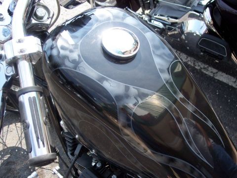 1972 Ford Ranchero - The custom paint on this motorcycle's gas tank features a flame design with subtle skull accents.