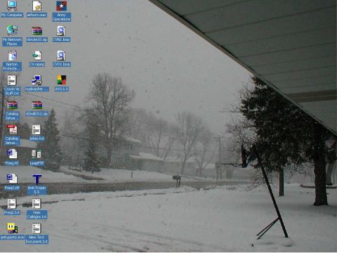 1999 Ford Crown Victoria - Desktop screenshot displays icons and a snowy scene wallpaper, possibly taken from a covered porch.