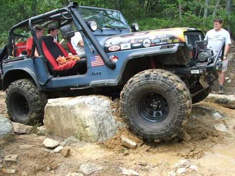 1996 Ford Bronco - A modified Jeep Wrangler navigates a challenging off-road course.