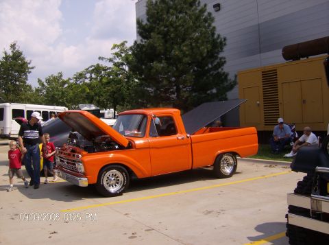 1970 Ford Ranchero - This orange pickup truck appears to be from the mid-1960s, not a 1970 model.