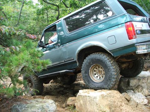 1996 Ford Bronco - This 1996 Ford Bronco navigates a rocky trail, its off-road capabilities.