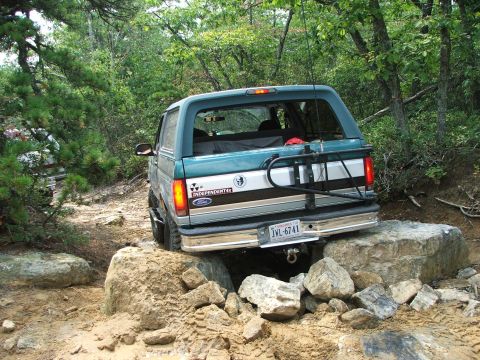 1996 Ford Bronco - This 1996 Ford Bronco is shown tackling a challenging rocky terrain on an off-road trail.