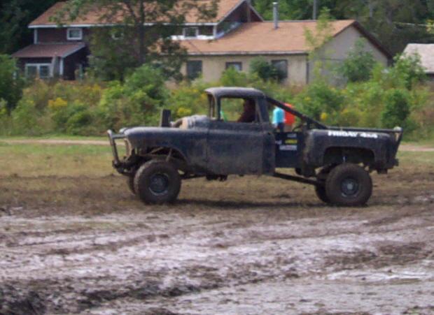 Black pickup truck with "FRIDAY 4X4" text on the side