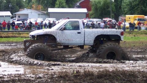 1979 Ford Bronco - Modified pickup truck attempts to navigate a mud bog during an event.