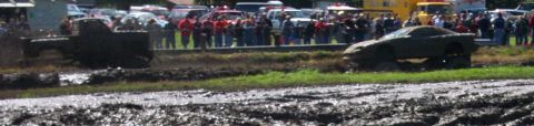 1979 Ford Bronco - Mud bogging event with a truck and a car stuck in the mud.
