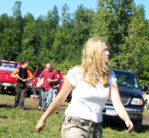 1979 Ford Bronco - A black SUV is visible in the background behind a woman.