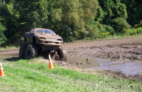 1979 Ford Bronco - Monster truck attempts to navigate a muddy obstacle course.