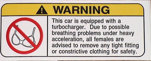 1999 Ford Crown Victoria - A humorous warning sticker advises females to remove constrictive clothing due to potential breathing issues under heavy acceleration from…