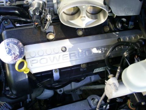 2003 Mercury Marauder - Close-up view of an engine bay, focusing on the valve cover and intake manifold.